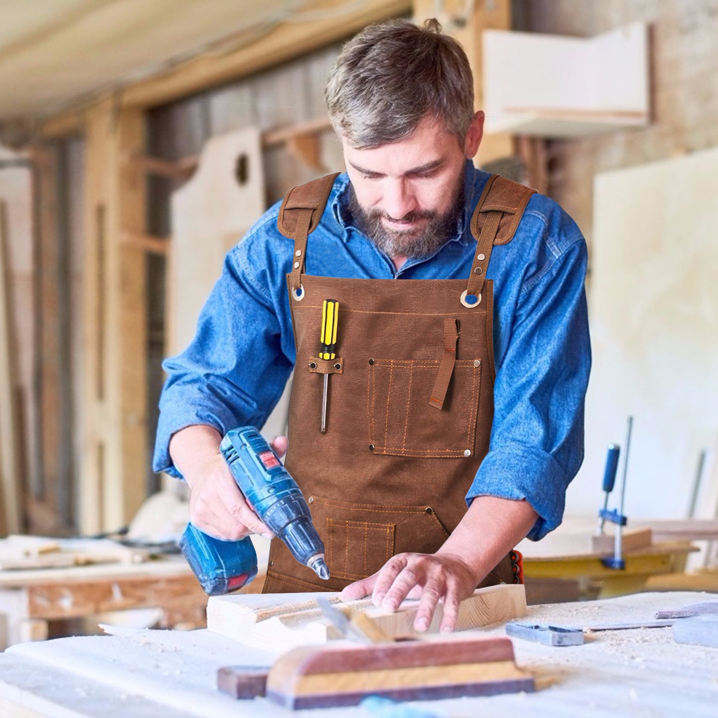 MAHAND woodworking apron made of durable woodhouseware material, with adjustable straps and multiple pockets for tools.